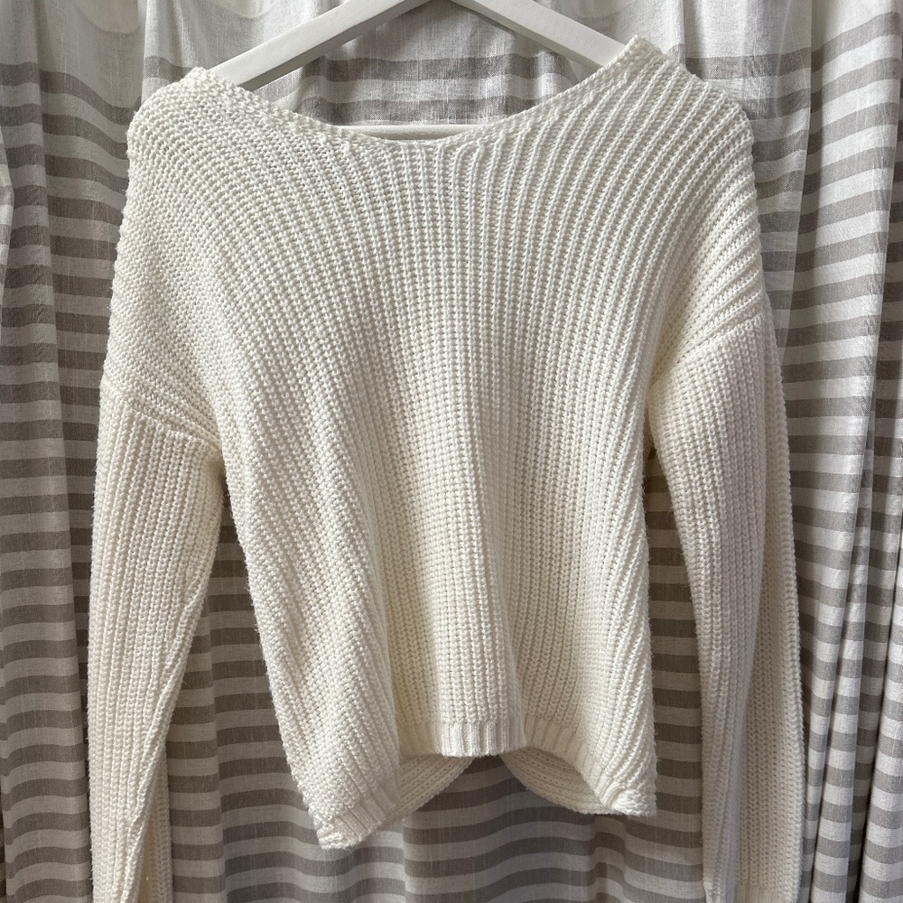 a cable knit twist sweater